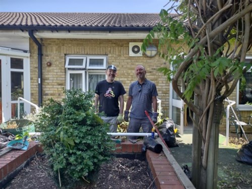 Photo of Dave and Michael Gregory standing in the Clifton Lodge garden