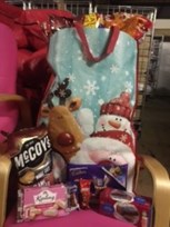 Pictures of Christmas hamper, crisps, jumper and a snowman