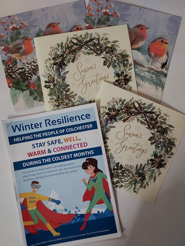 Christmas cards laid out on a table.