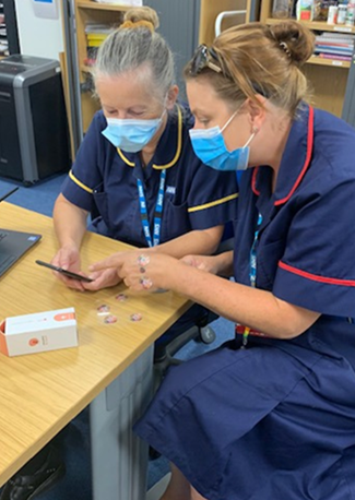Julie Merrick (Community Nurse Team Leader) and Katie Fox (Community Wound Care Team Lead) using the Julie Merrick (Community Nurse Team Leader) and Katie Fox (Community Wound Care Team Lead) using the Minuteful for Wound app.