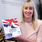 Photo of Diane Palmer holding her Innovation in my Speciality Award.