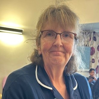 Picture of nurse Melanie Rolfe, wearing her nurses uniform.