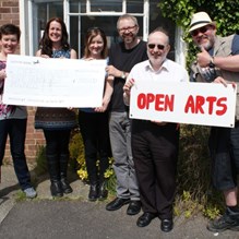 Volunteers at open arts were presented with a cheque for funding