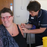 Sally Morris, CEO, receiving her flu vaccination