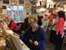 Picture of people attending an open arts class
