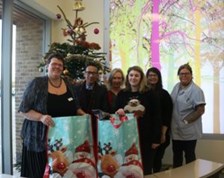 Sally Morris, CEO, with staff at Brockfield House delivering Christmas gifts bags for patients