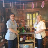 Picture of Sandie Woodford and Michelle McIver stadning in one of the reminiscence pods.