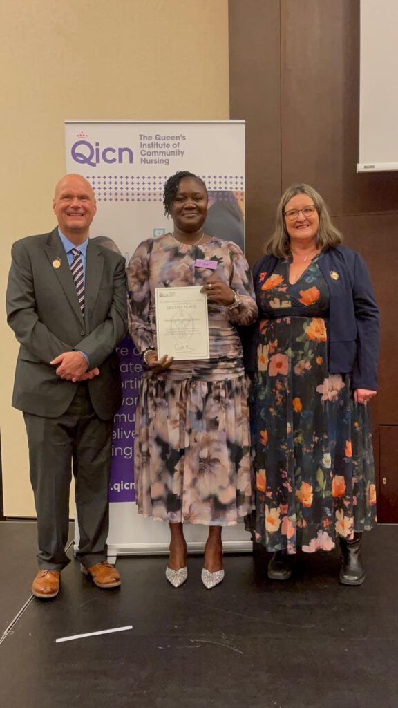 Photo of Emefa Dokosi receiving her Queen's Nurse award.