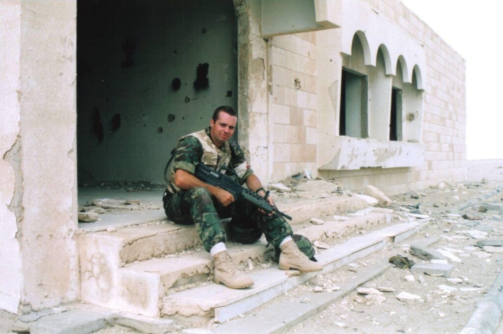 Kevin Russell pictured in combat fatigues with medic badge