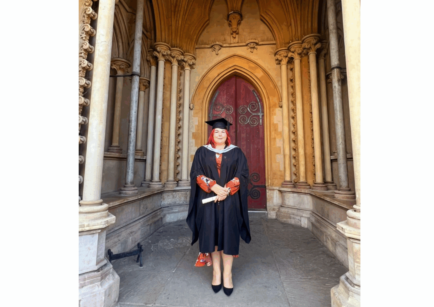 Photograph of Pamela Stevens wearing her graduation gown and at.