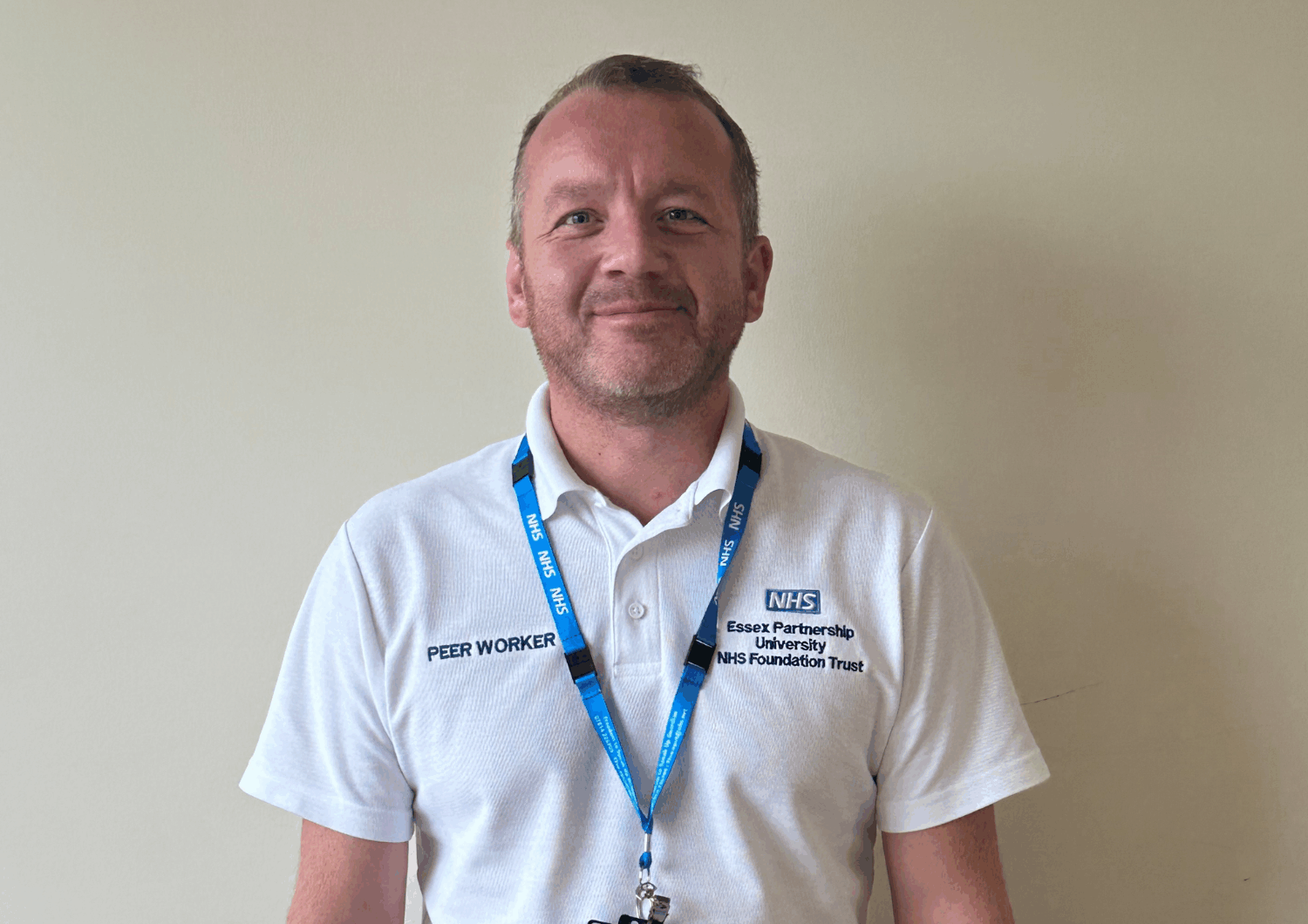 man in peer worker uniform