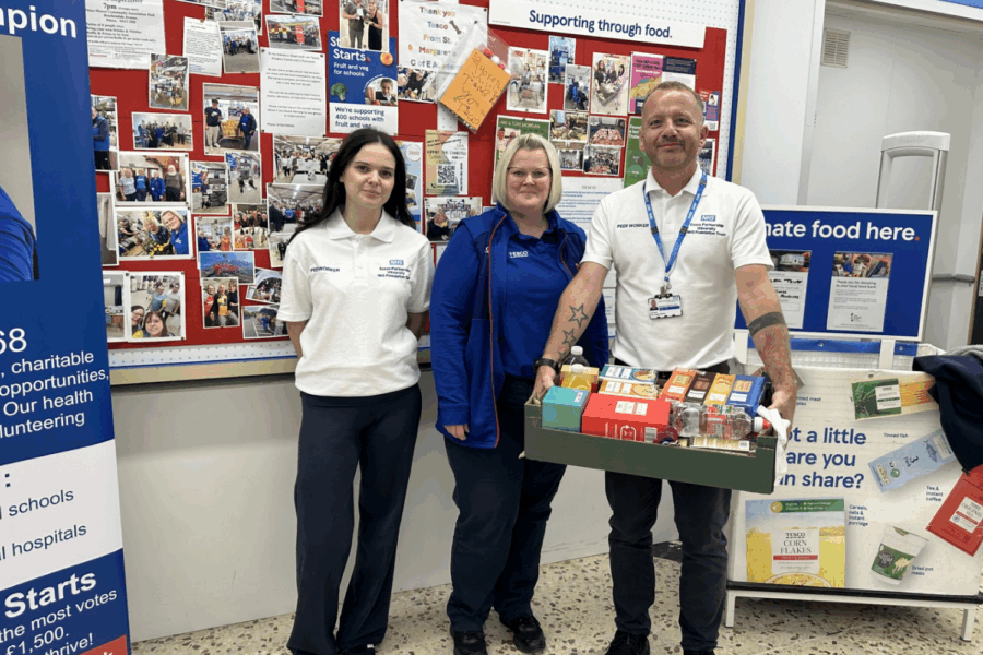 Photo of Louisa and Dan with Tesco member of staff