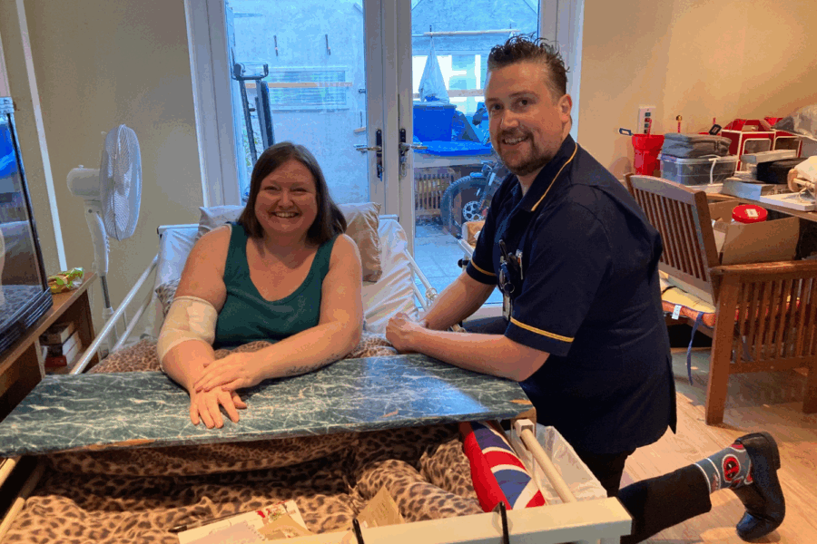 Photo of Sharon Livett and staff member David Morris