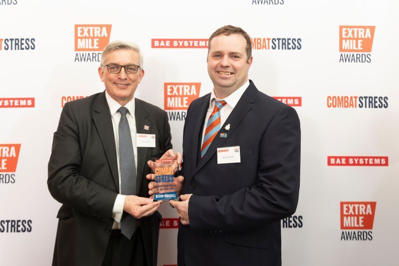 Kevin Russell being presented with Extra Mile award from Combat Stress
