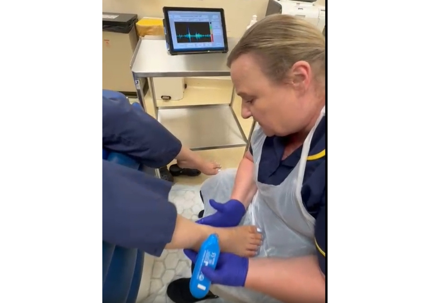 Nurse checking a patients foot