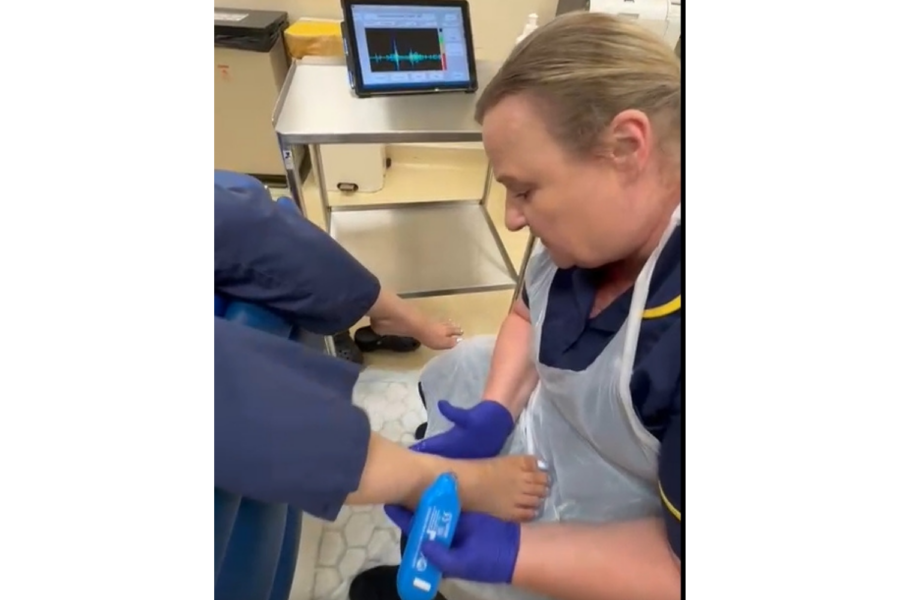 Nurse checking a patients foot
