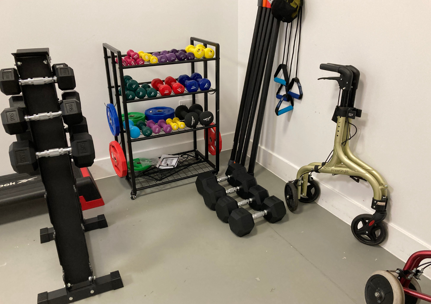 New rehabilitation gym equipment including dumbbells, weight racks, and walking aids at St Margaret's Hospital in Epping.