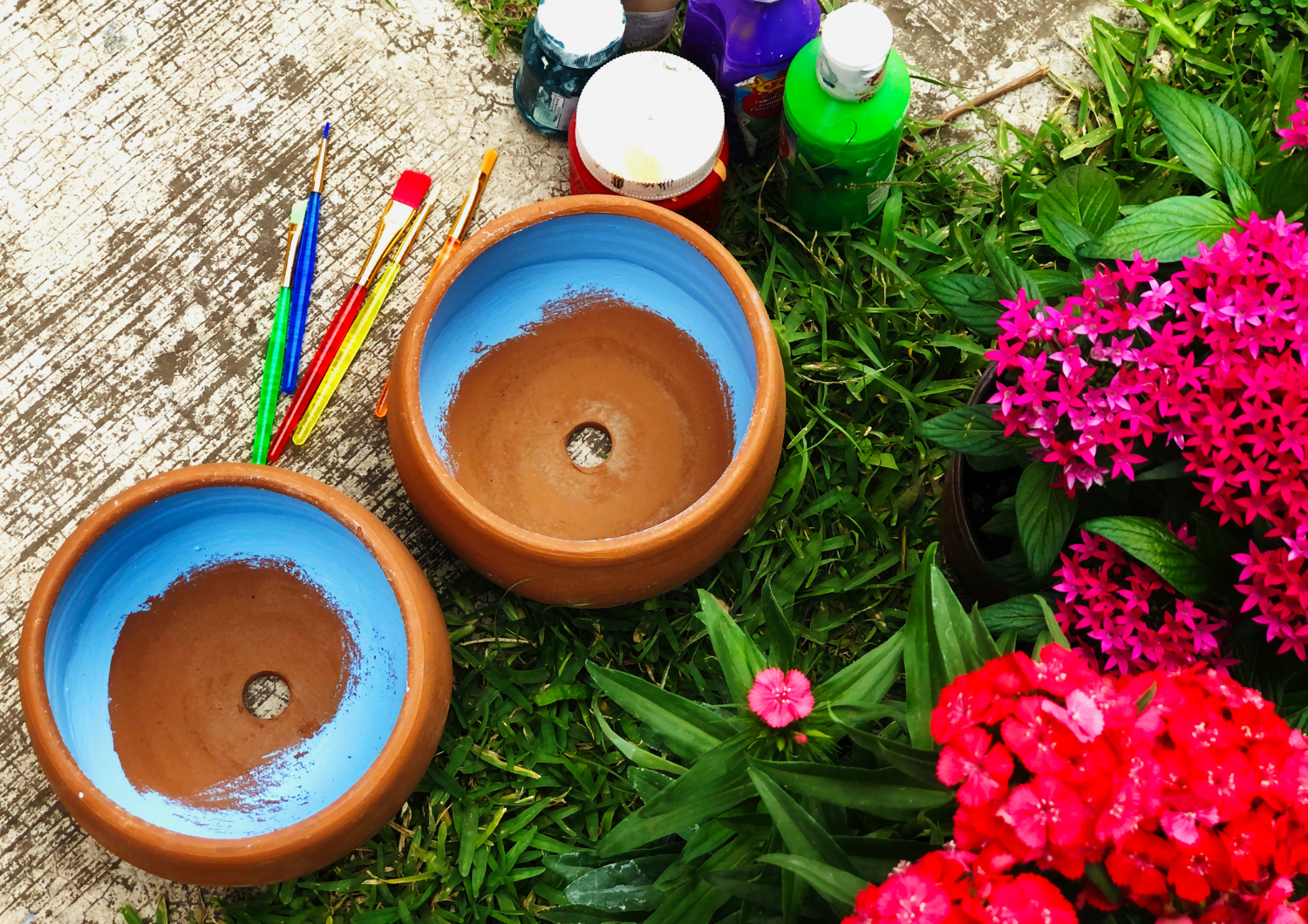 Plant pots being painted.