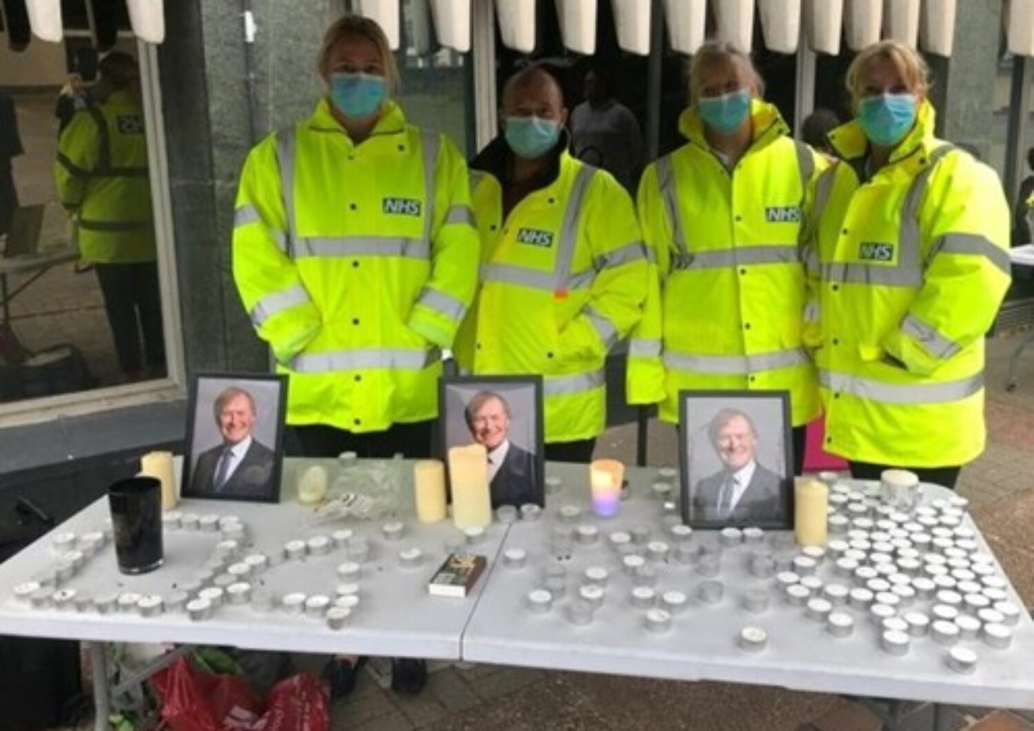 Photo of staff joining a vigil for MP David Amos
