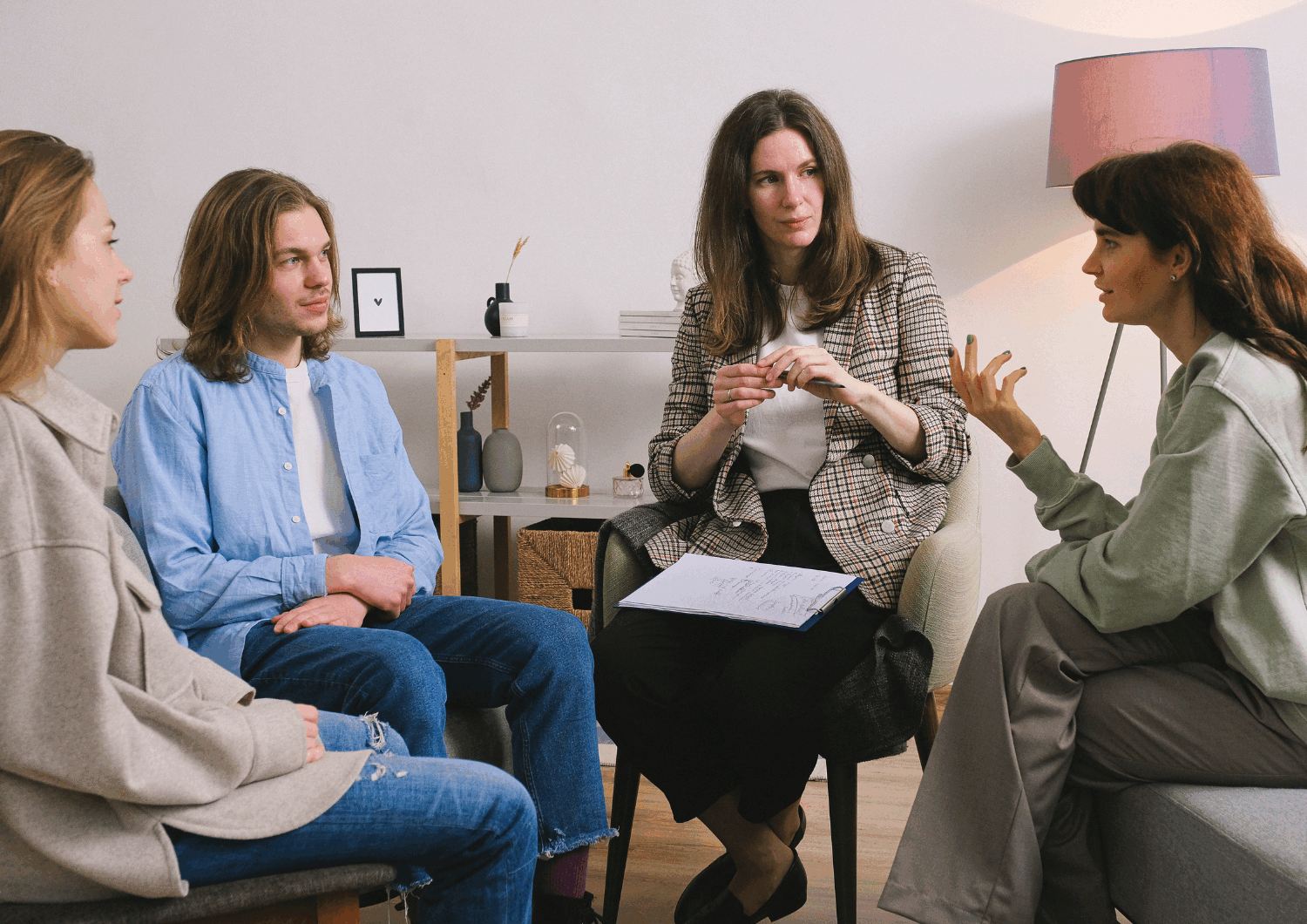 Group of people sitting i a circle talking