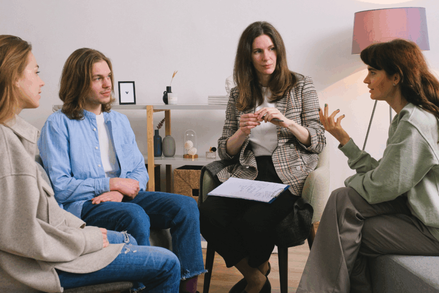 Group of people sitting i a circle talking